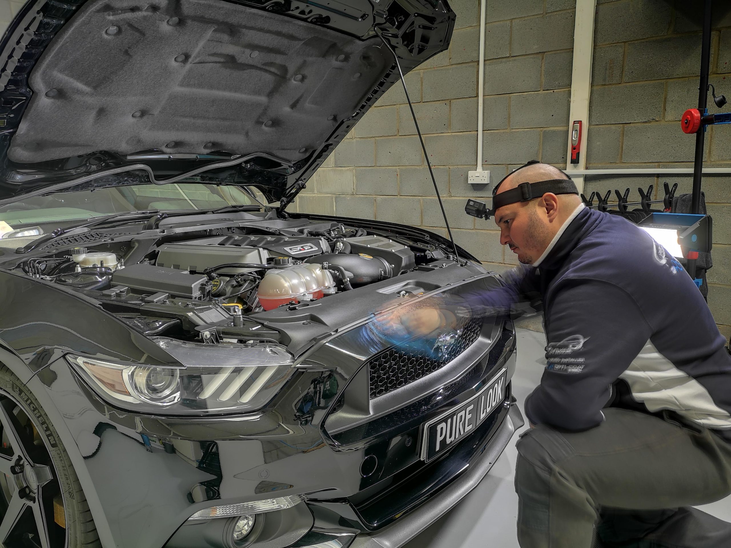 person cleaning car auto detailing car valeting at Pure Look Auto Detailing