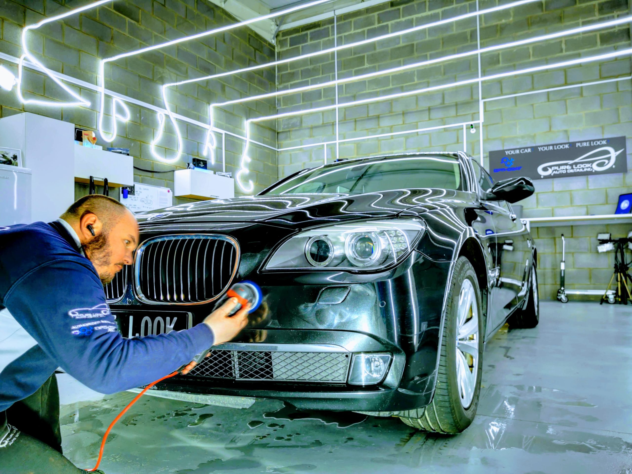Pure Look Auto Detailing person correcting car paint